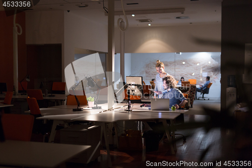 Image of young designers in the night office