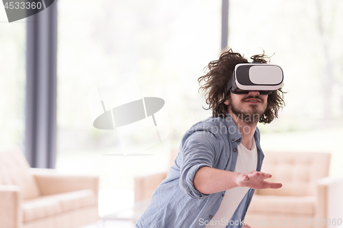 Image of man using VR-headset glasses of virtual reality