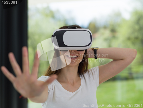 Image of woman using VR-headset glasses of virtual reality