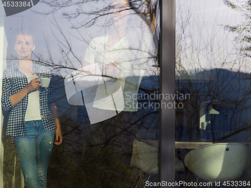 Image of young couple enjoying morning coffee