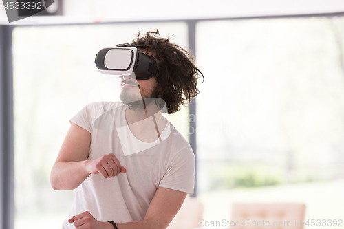 Image of man using VR-headset glasses of virtual reality