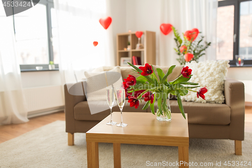 Image of champagne glasses and flowers on valentines day