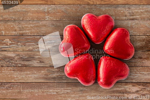 Image of close up of red heart shaped chocolate candies