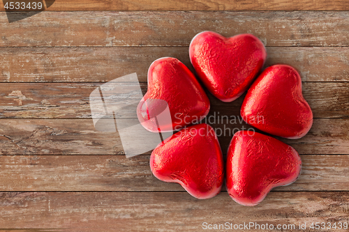 Image of close up of red heart shaped chocolate candies