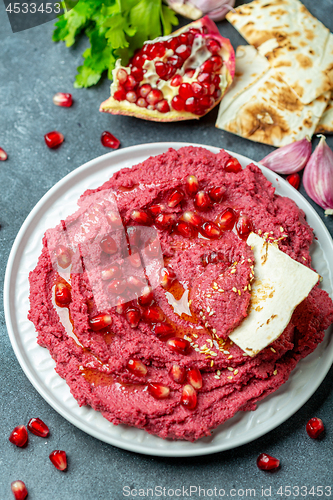 Image of Homemade traditional beetroot hummus.