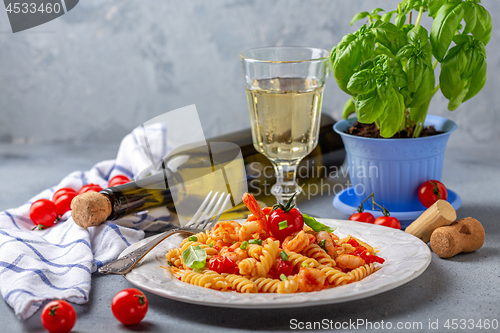 Image of Pasta with tomato sauce and shrimp.