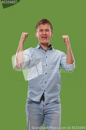 Image of Winning success man happy ecstatic celebrating being a winner. Dynamic energetic image of male model