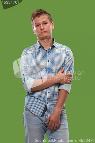 Image of Beautiful bored man bored isolated on green background