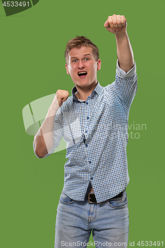 Image of Winning success man happy ecstatic celebrating being a winner. Dynamic energetic image of male model