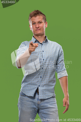 Image of The overbearing businessman point you and want you, half length closeup portrait on green background.