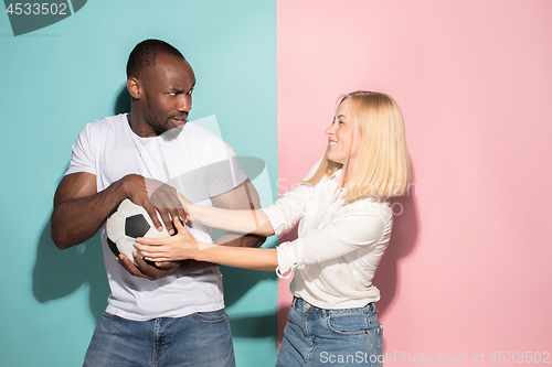 Image of The unhappy and angry fans on colored blue and pink background.