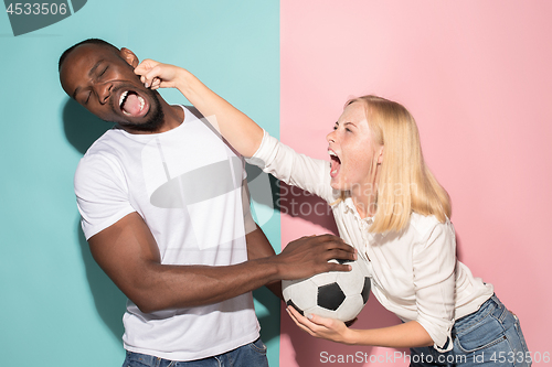 Image of The unhappy and angry fans on colored blue and pink background.