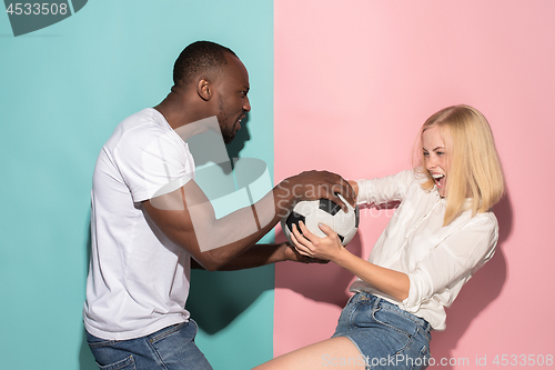 Image of The unhappy and angry fans on colored blue and pink background.