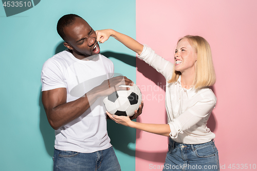 Image of The unhappy and angry fans on colored blue and pink background.