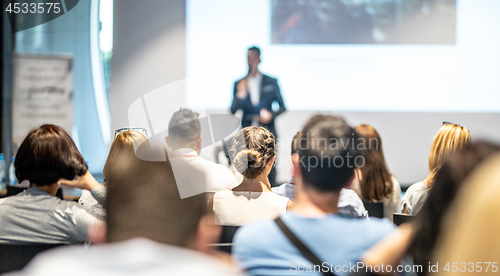 Image of Male business speaker giving a talk at business conference event.