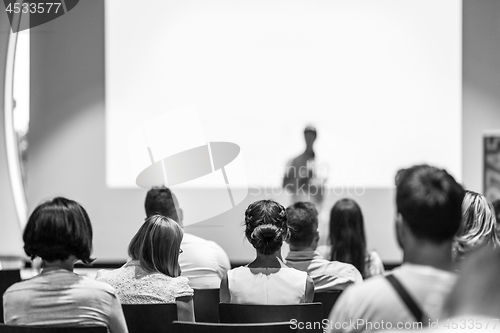 Image of Business speaker giving a talk at business conference event.