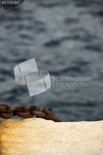 Image of Old and rusty mooring post