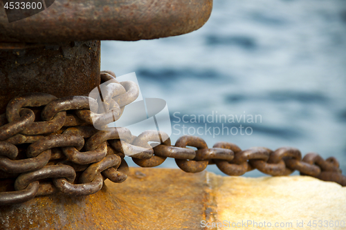 Image of Old and rusty mooring post