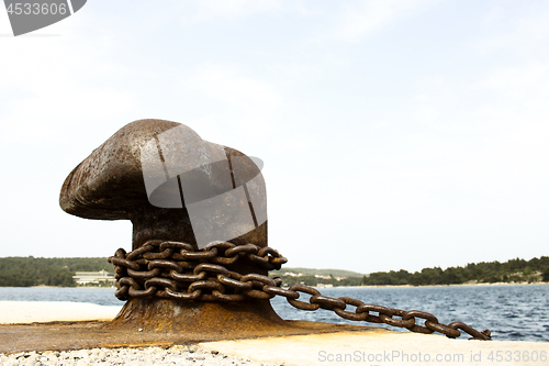 Image of Old and rusty mooring post