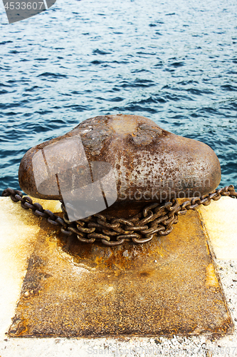 Image of Old and rusty mooring post