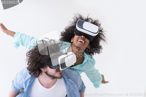 Image of multiethnic couple getting experience using VR headset glasses