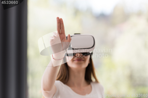 Image of woman using VR-headset glasses of virtual reality