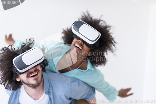 Image of multiethnic couple getting experience using VR headset glasses