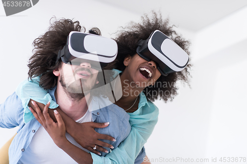 Image of multiethnic couple getting experience using VR headset glasses