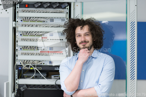 Image of business man engeneer in datacenter server room