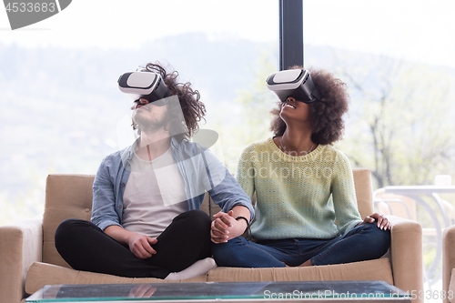 Image of Multiethnic Couple using virtual reality headset