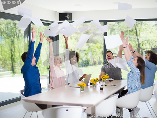 Image of multiethnic startup Group of young business people throwing docu