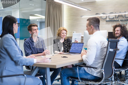Image of Startup Business Team At A Meeting at modern office building