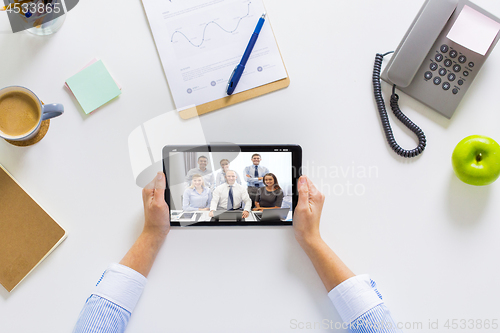 Image of businesswoman having video conference on tablet