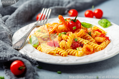 Image of Tomato pasta fusilli with prawns.