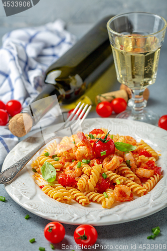 Image of Fusilli pasta with shrimp in tomato sauce.
