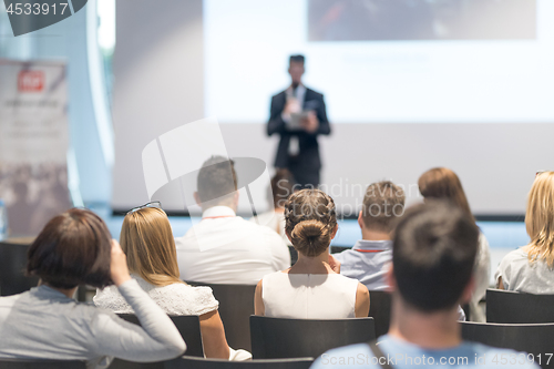 Image of Male business speaker giving a talk at business conference event.