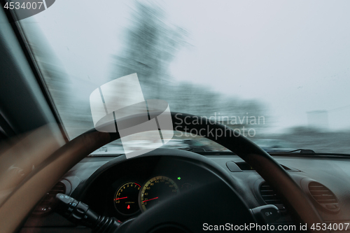 Image of Riding behind the wheel of a car in winter