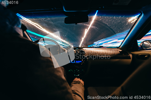 Image of Riding through the city by car