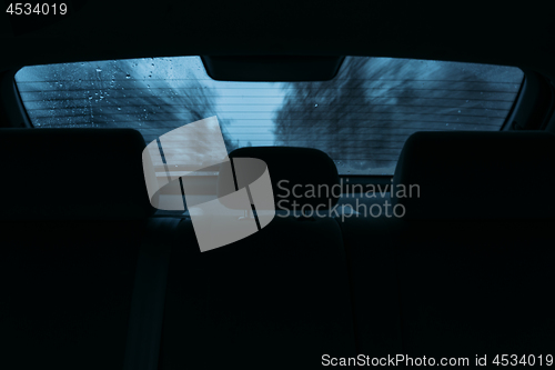 Image of driving a car in the view the rear window