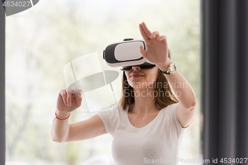 Image of woman using VR-headset glasses of virtual reality