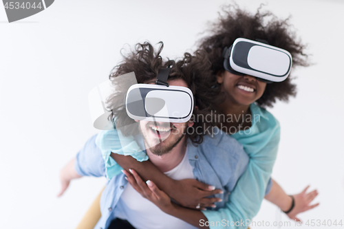 Image of multiethnic couple getting experience using VR headset glasses