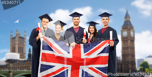 Image of graduate students with diplomas and british flag