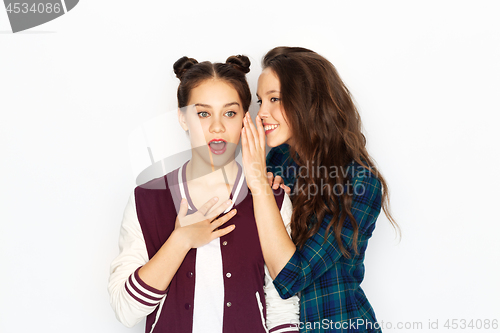 Image of teenage girls gossiping or sharing secrets