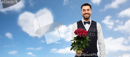 Image of happy man with bunch of red roses