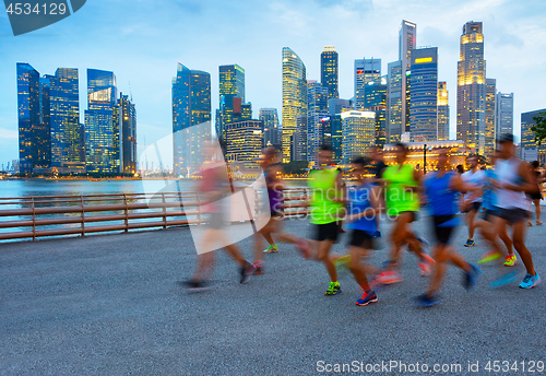 Image of Running group of people. Singapore