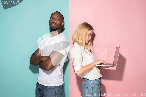 Image of Businesswoman hugging laptop. Love to computer concept. Attractive female half-length front portrait