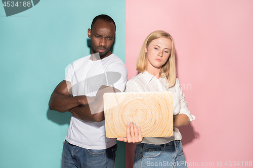 Image of Businesswoman hugging laptop. Love to computer concept. Attractive female half-length front portrait