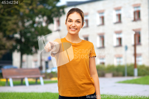 Image of teenage girl pointing finger at you over campus