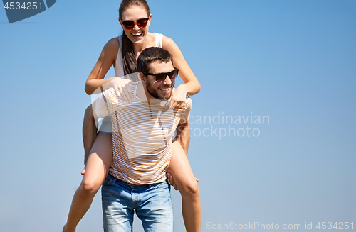 Image of happy couple having fun in summer