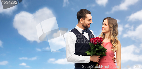 Image of couple with bunch of flowers on valentines day